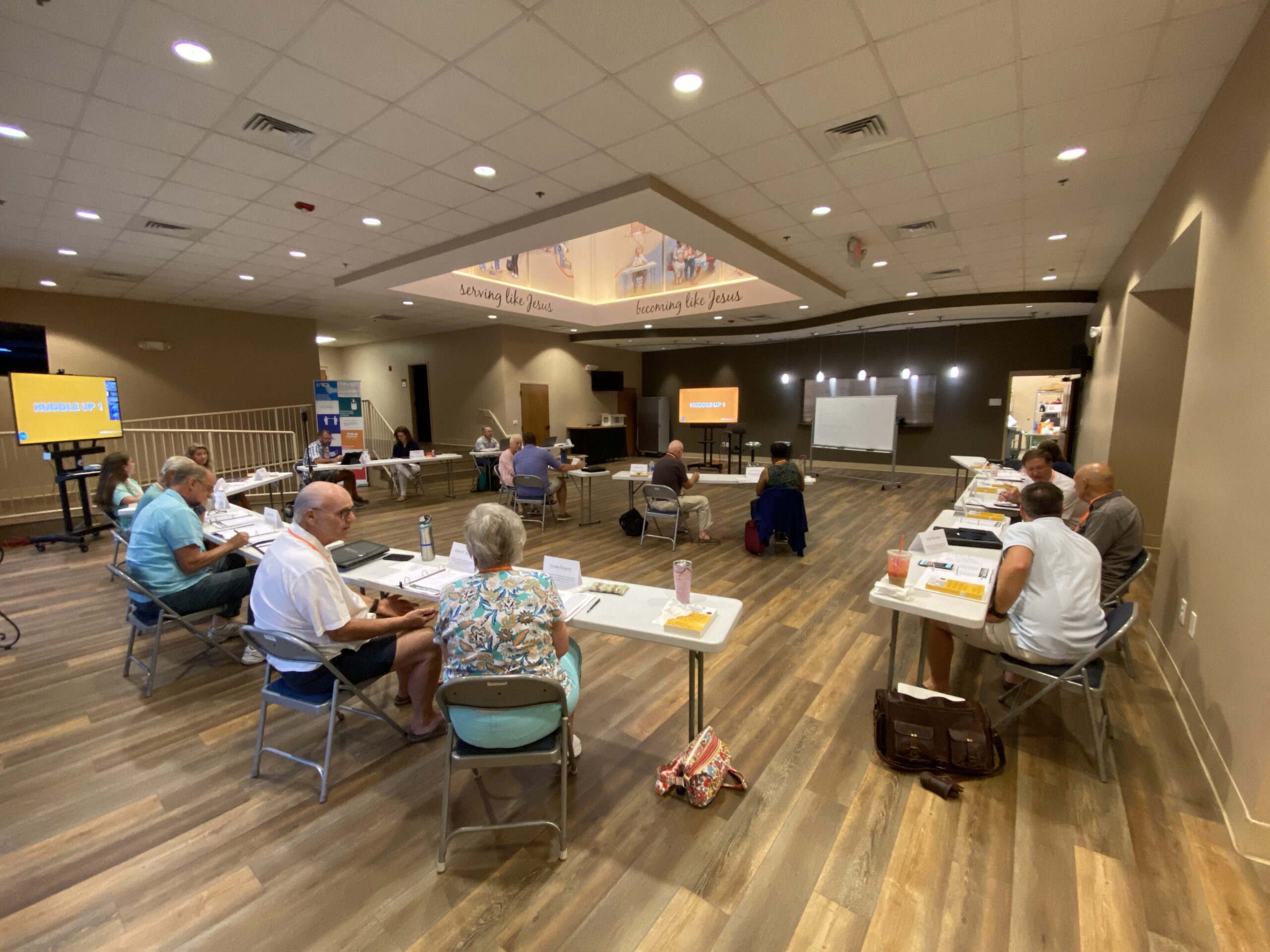 A church leadership team in a strategic planning conversation with a guide